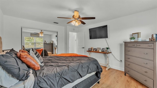 bedroom with ceiling fan and light hardwood / wood-style floors