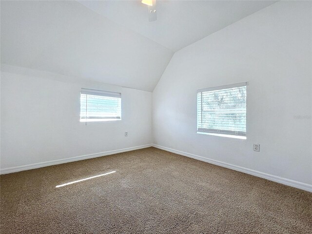 bonus room featuring vaulted ceiling and carpet flooring