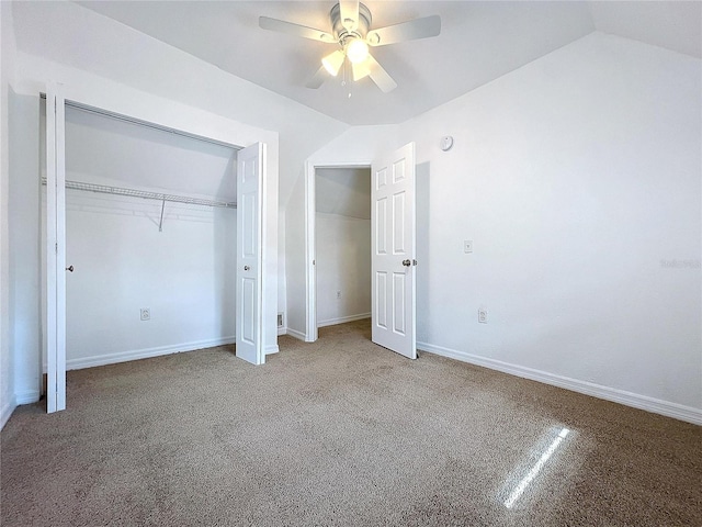 unfurnished bedroom with ceiling fan, light carpet, and lofted ceiling