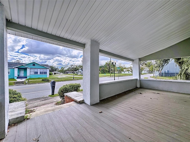 wooden deck featuring covered porch