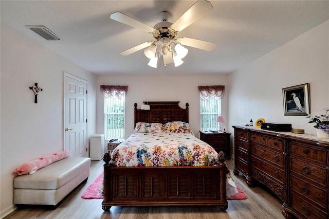 bedroom featuring ceiling fan and light wood-type flooring