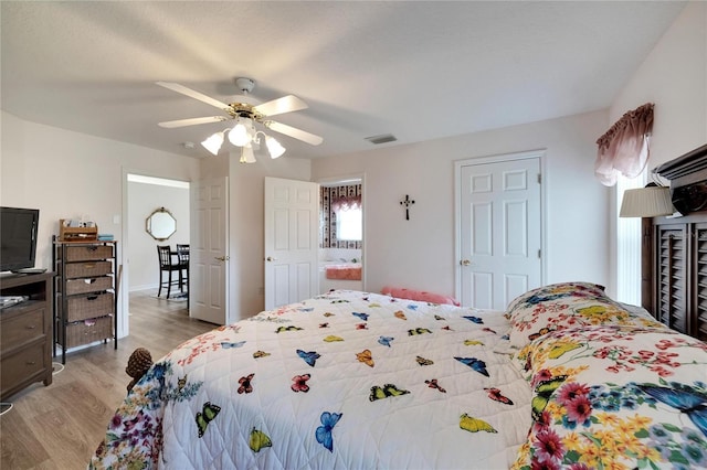 bedroom with ceiling fan and light wood-type flooring