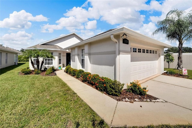 view of front of house with a garage and a front lawn