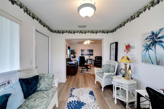 interior space with ceiling fan and light wood-type flooring