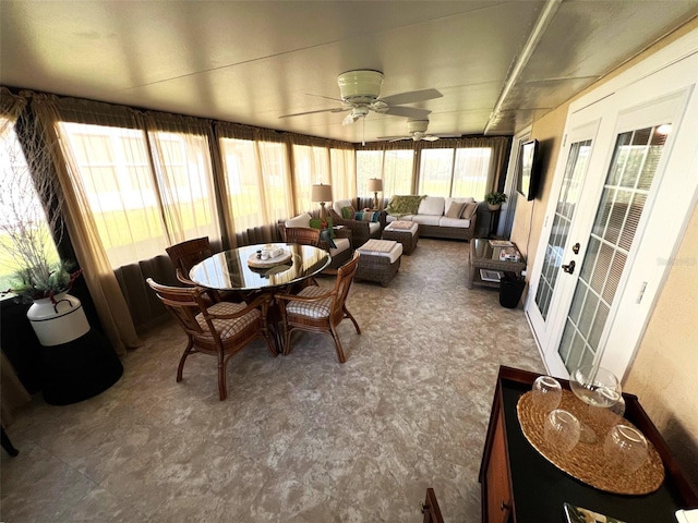 sunroom featuring ceiling fan