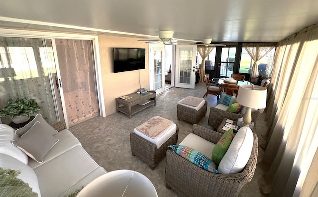 living room with ceiling fan and french doors