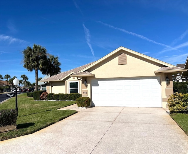 single story home featuring a front yard and a garage