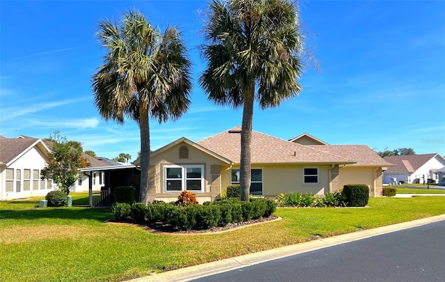 view of front facade with a front lawn