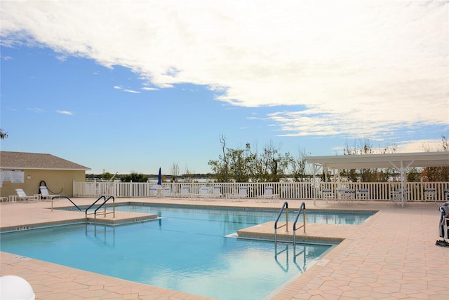 view of swimming pool featuring a patio area