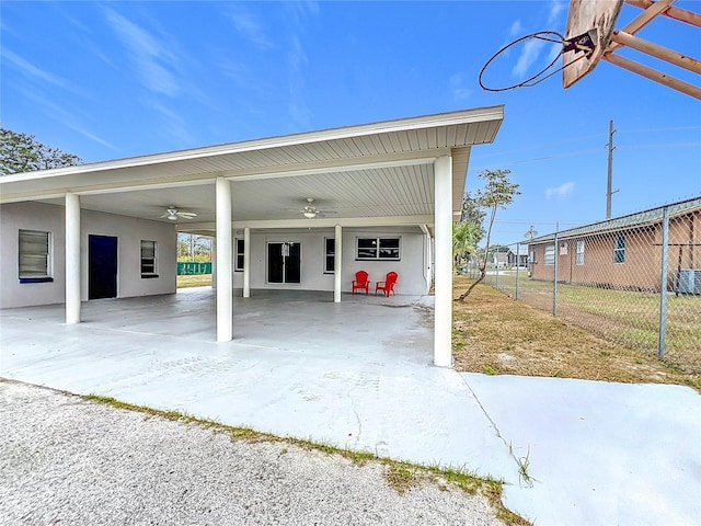 garage featuring ceiling fan and a carport