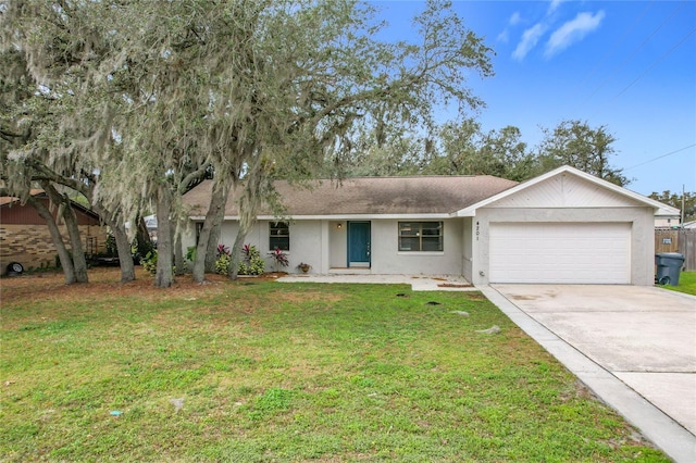 ranch-style home with a front lawn and a garage