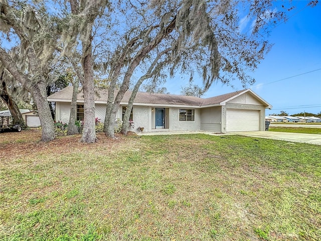 single story home featuring a garage and a front yard