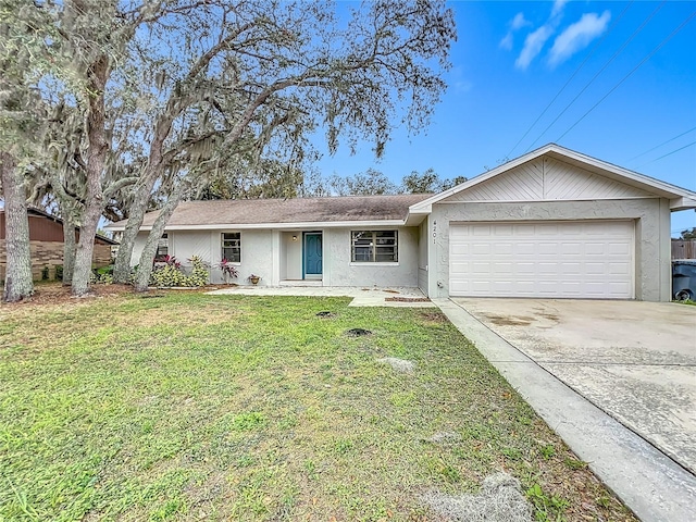 ranch-style home with a front yard and a garage