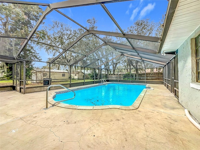 view of pool featuring a lanai and a patio area