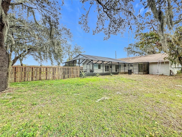 view of yard with a lanai