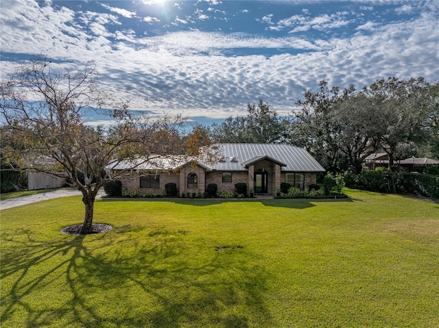 ranch-style home with a front lawn