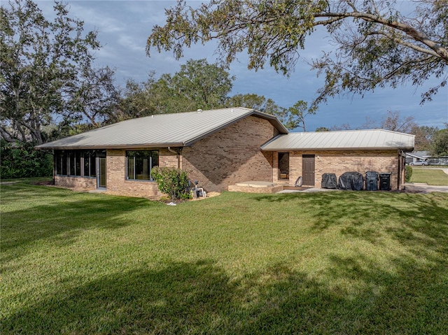 view of home's exterior with a yard