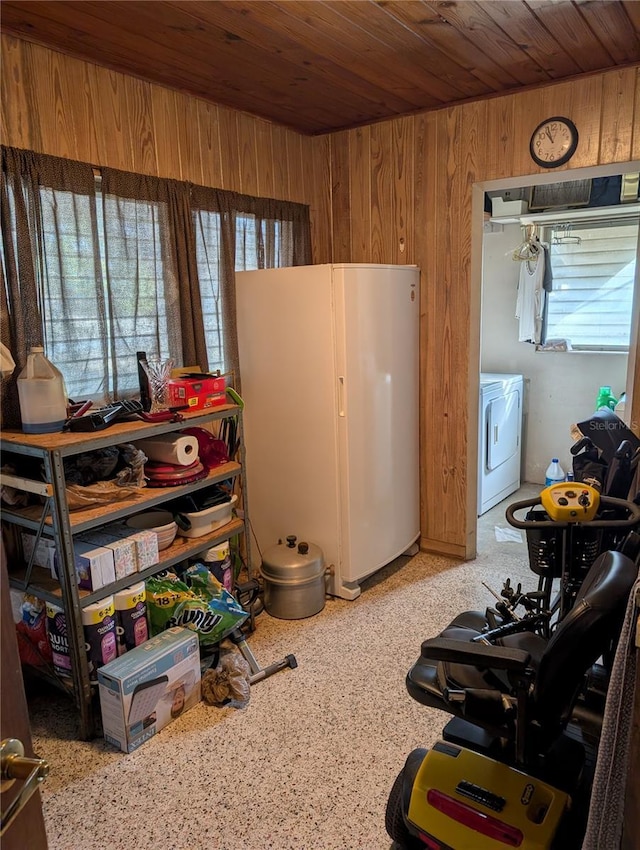 miscellaneous room with wooden walls, washer / clothes dryer, and wooden ceiling