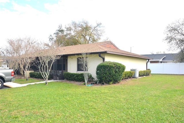 17 Kendra Ct, Winter Haven, FL 33880 - view of home's exterior with central AC unit and a lawn