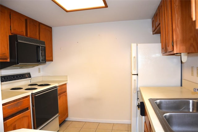 17 Kendra Ct, Winter Haven, FL 33880 - kitchen with light tile patterned flooring, white electric range oven, and sink