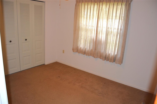 17 Kendra Ct, Winter Haven, FL 33880 - unfurnished bedroom with carpet flooring and a closet