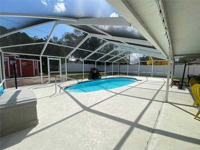 view of pool featuring a patio area and glass enclosure