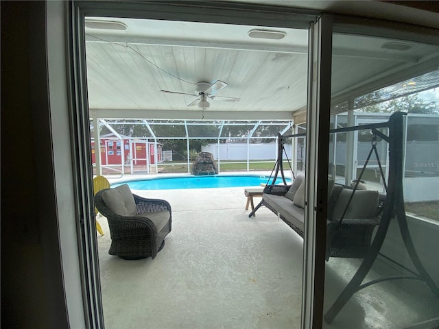 view of swimming pool with ceiling fan