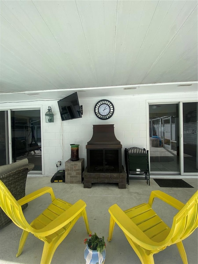 view of patio featuring a fireplace