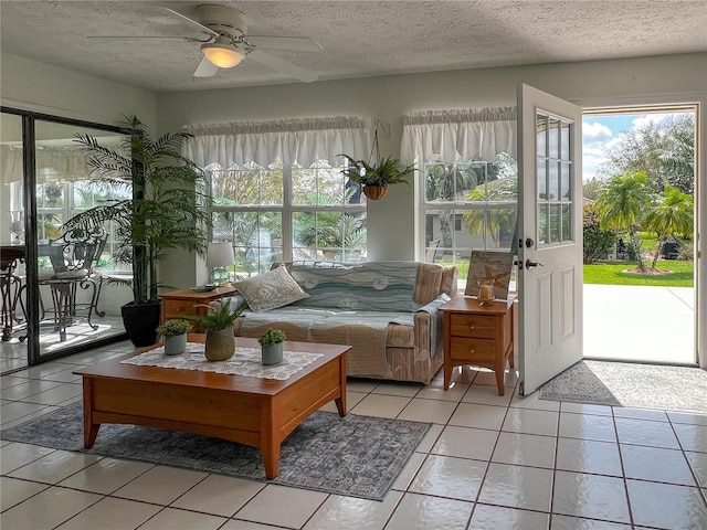 sunroom featuring ceiling fan