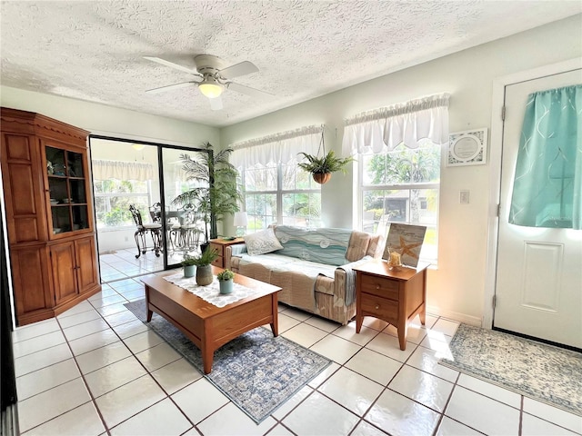 sunroom featuring a ceiling fan