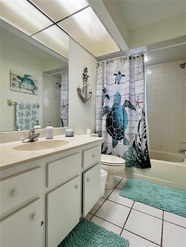 full bath with shower / bathtub combination with curtain, tile patterned flooring, vanity, and toilet