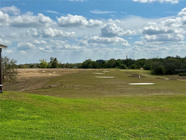 view of home's community with a lawn