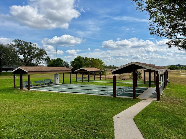 view of home's community with a yard, a gazebo, and shuffleboard