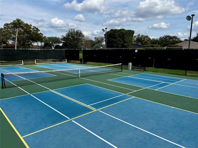 view of sport court with fence