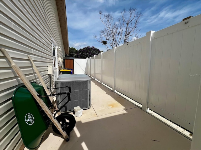 view of patio featuring central AC unit and a fenced backyard