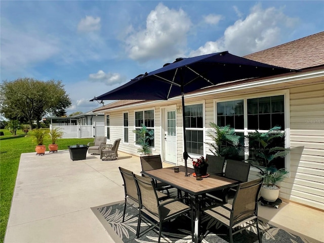 view of patio / terrace with outdoor dining area and fence
