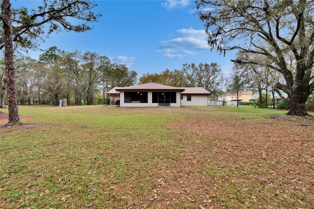 view of yard featuring a sunroom