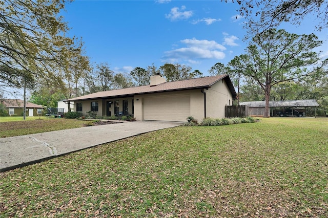 ranch-style house featuring a chimney, stucco siding, a garage, driveway, and a front lawn