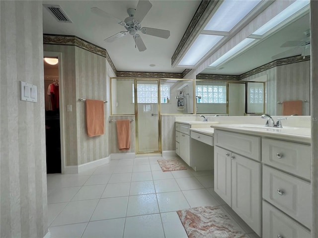 full bathroom featuring visible vents, a spacious closet, a shower stall, vanity, and tile patterned floors