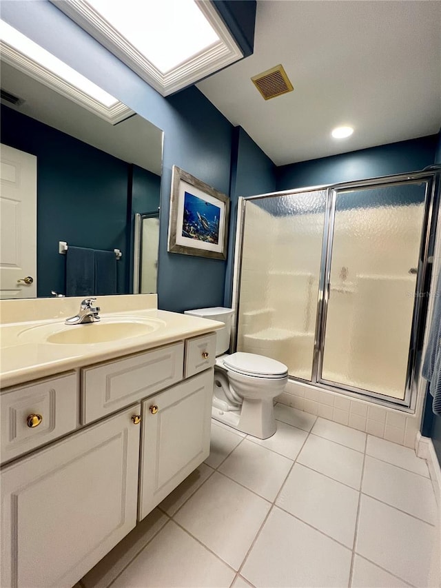 bathroom with a stall shower, tile patterned flooring, visible vents, and toilet