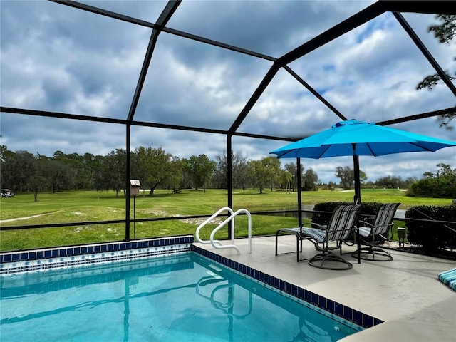 pool featuring a lawn, a patio area, and a lanai