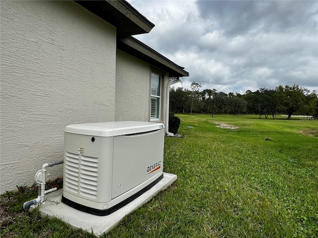 exterior details featuring a power unit and stucco siding