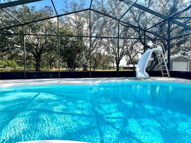 view of pool with a lanai