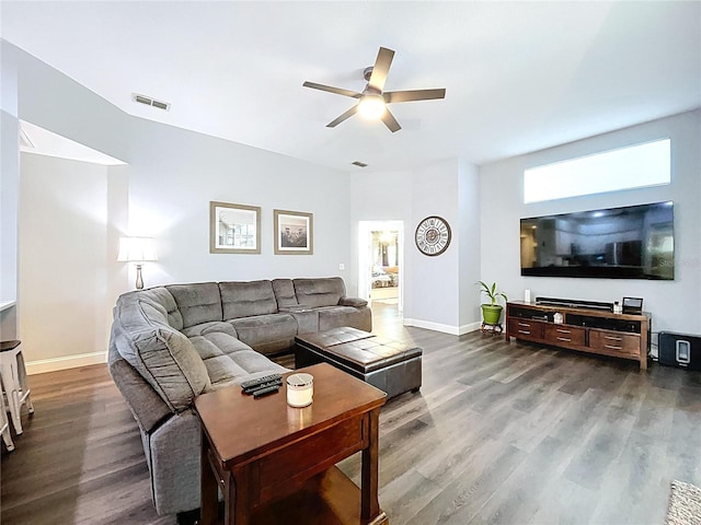 living area with wood finished floors, baseboards, a ceiling fan, and visible vents