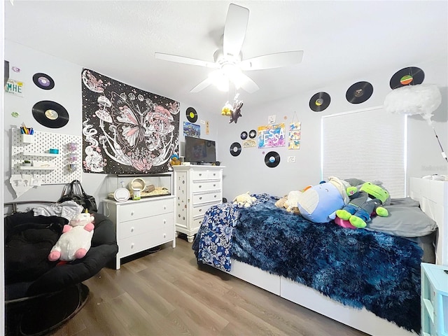 bedroom featuring ceiling fan and wood finished floors