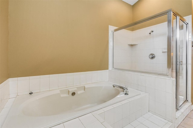 6928 Hayter Ln, Lakeland, FL 33813 - full bath with a bath, tile patterned flooring, and a stall shower