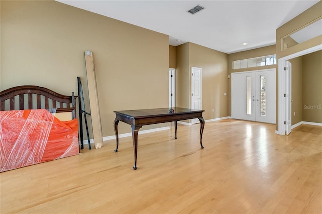 6928 Hayter Ln, Lakeland, FL 33813 - entryway with baseboards, visible vents, and light wood-type flooring