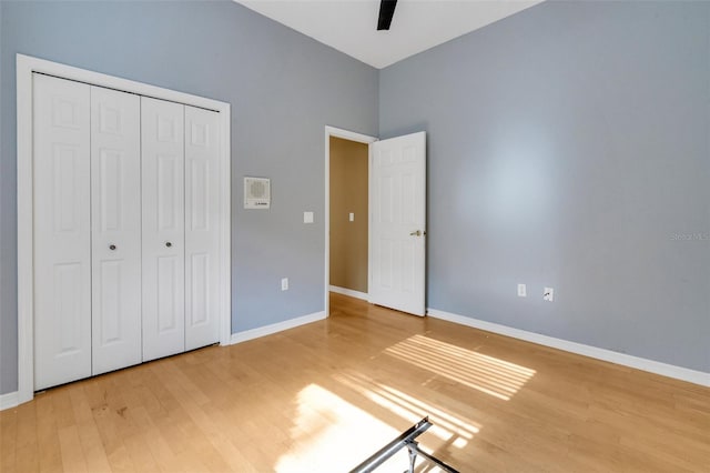 6928 Hayter Ln, Lakeland, FL 33813 - unfurnished bedroom with light wood-type flooring, a closet, baseboards, and ceiling fan