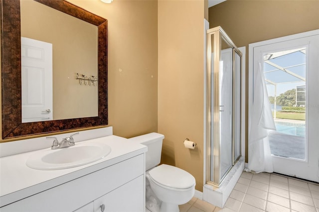 6928 Hayter Ln, Lakeland, FL 33813 - full bathroom with toilet, vanity, tile patterned floors, and a stall shower