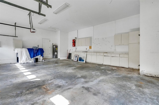 6928 Hayter Ln, Lakeland, FL 33813 - garage featuring electric water heater and a garage door opener